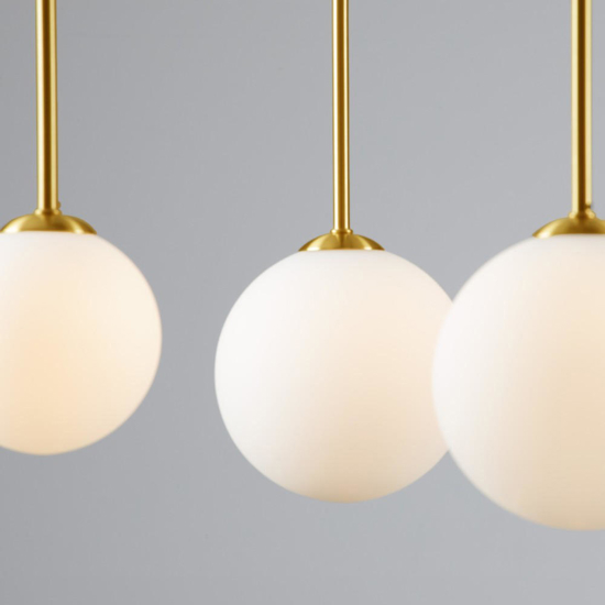 Lampadario oro nero multi sfere vetro bianco