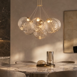 Lampadario oro sfere raggruppate trasparenti ondulate per sala da pranzo contemporanea