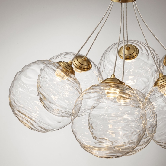 Lampadario oro sfere raggruppate trasparenti ondulate per sala da pranzo contemporanea