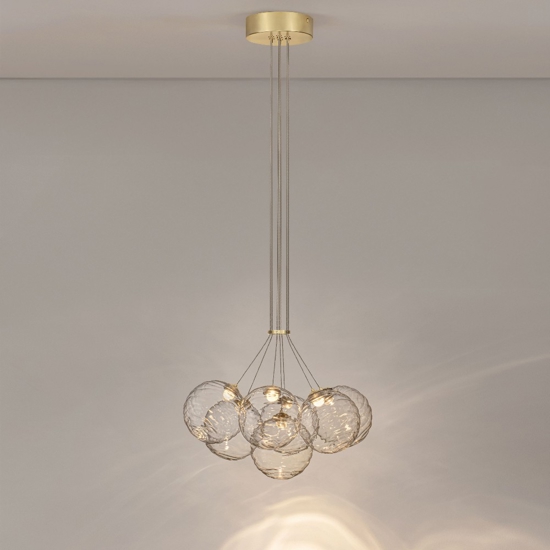 Lampadario oro sfere raggruppate trasparenti ondulate per sala da pranzo contemporanea