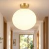 Plafoniera moderna sfera ottone satinato vetro 30cm