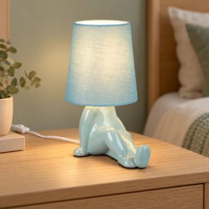 Abat-jour per comodino in ceramica a figura umana con paralume in tessuto azzurro