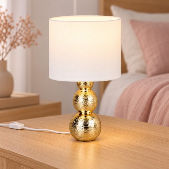 Abat-jour per comodino in ceramica oro con paralume in vetro bianco